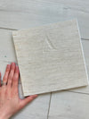 Hand-Bound Book: Ivory fabric, tape binding, 8.5 x 8.5 inches