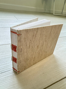 Hand-Bound Book: Ivory fabric, tape binding, 5.5 x 4.25 inches