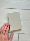 Hand-Bound Book: Taupe fabric, coptic binding, 3.25 x 4.75 inches