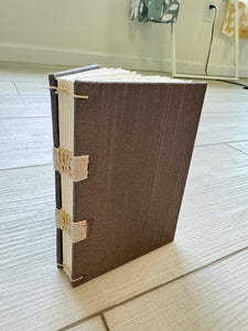 Hand-Bound Book: Dark silver fabric, tape binding, 3.25 x 4.75 inches